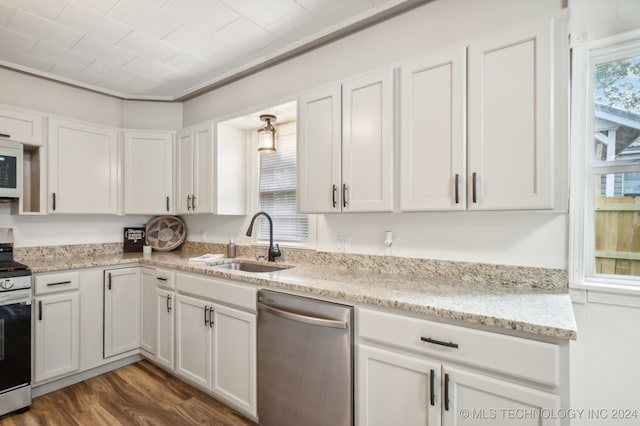 kitchen featuring white cabinetry, stainless steel appliances, sink, and dark hardwood / wood-style flooring