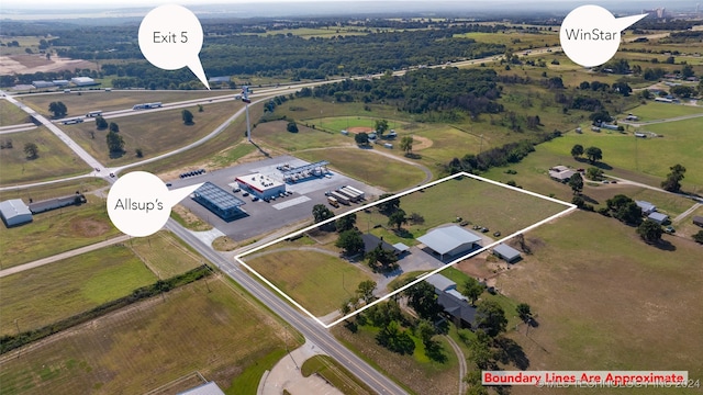 birds eye view of property featuring a rural view