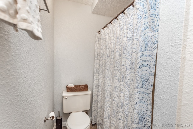 bathroom featuring toilet