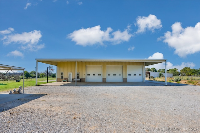 exterior space featuring a lawn and a garage