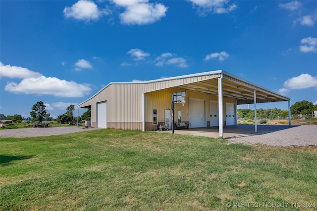 exterior space with an outdoor structure and a yard