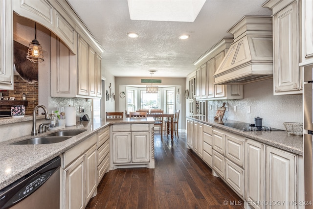 kitchen featuring black electric stovetop, custom range hood, stainless steel dishwasher, dark hardwood / wood-style floors, and hanging light fixtures