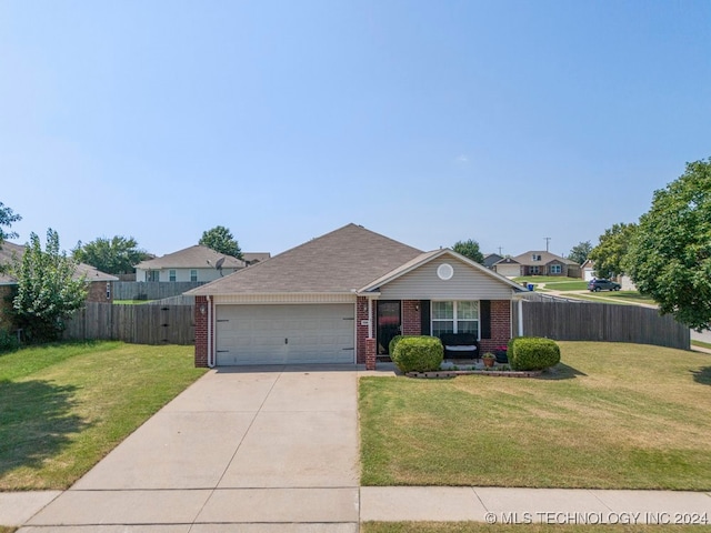 single story home with a garage and a front yard