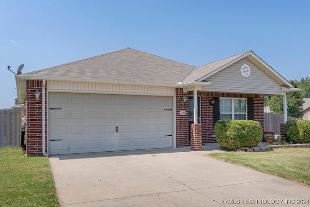 single story home with a front lawn and a garage