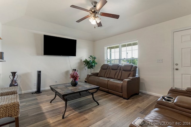 living room featuring ceiling fan and hardwood / wood-style floors