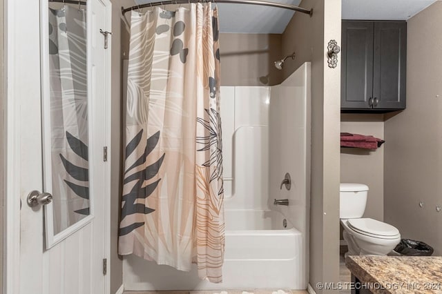 full bathroom with shower / tub combo with curtain, toilet, and vanity