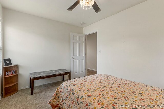 bedroom with ceiling fan and carpet flooring