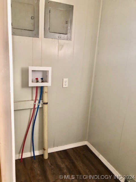 washroom featuring dark hardwood / wood-style flooring, hookup for a washing machine, and electric panel