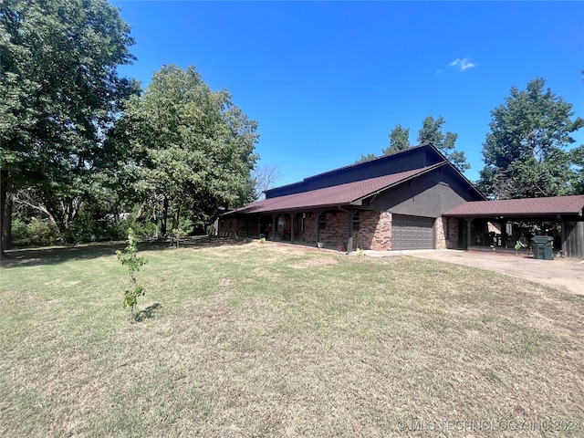 view of home's exterior with a yard and a garage