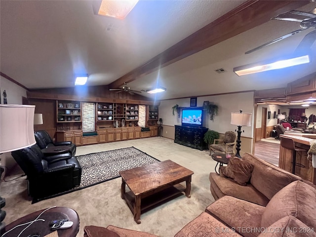 carpeted living room with lofted ceiling with beams, built in shelves, and ceiling fan