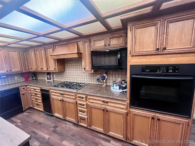 kitchen featuring black appliances, backsplash, coffered ceiling, custom exhaust hood, and dark hardwood / wood-style floors