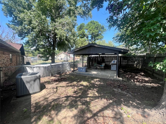 view of yard featuring a patio area and central AC unit