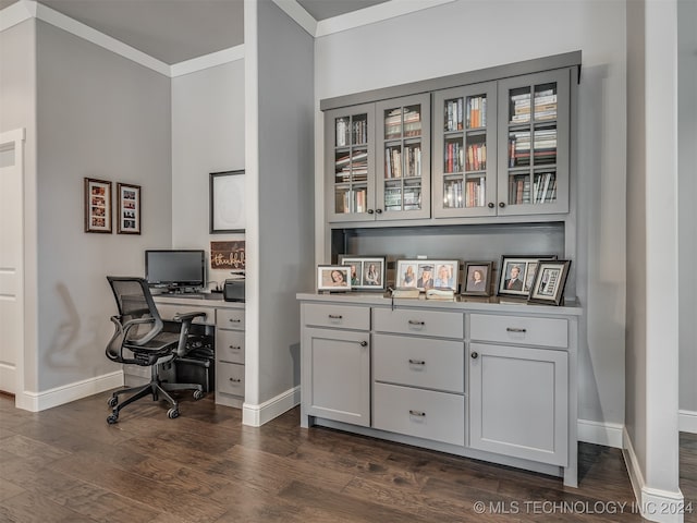 office space with dark hardwood / wood-style floors and ornamental molding