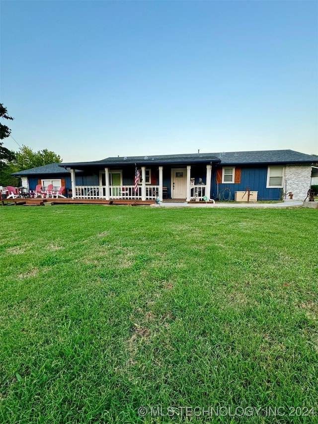 114399 Oak Rd, Eufaula, OK 74432 - view of front facade featuring a wooden deck and a front lawn