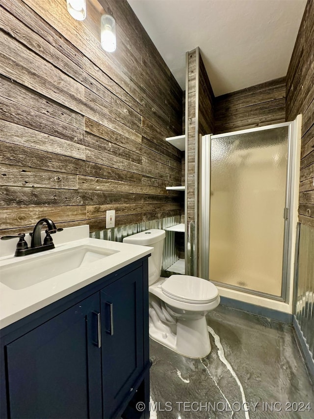 bathroom featuring concrete floors, wooden walls, vanity, toilet, and walk in shower