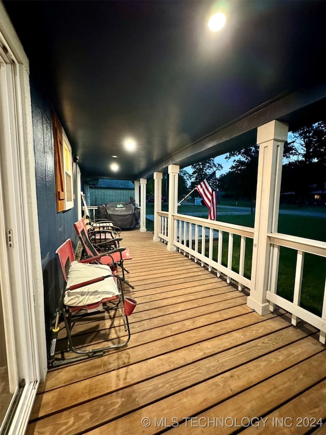 view of deck at twilight