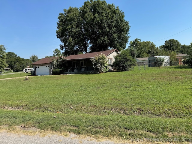 view of front of house with a garage and a front yard