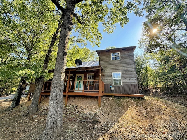 back of property featuring a wooden deck