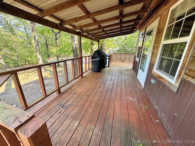 wooden terrace with area for grilling