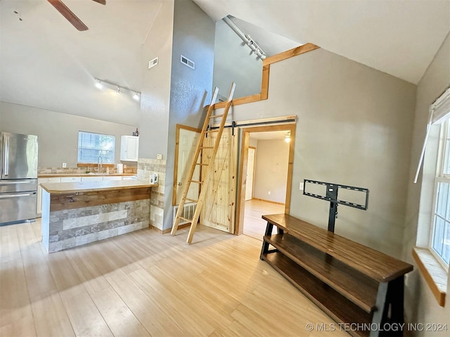 bathroom featuring hardwood / wood-style flooring, sink, ceiling fan, and rail lighting