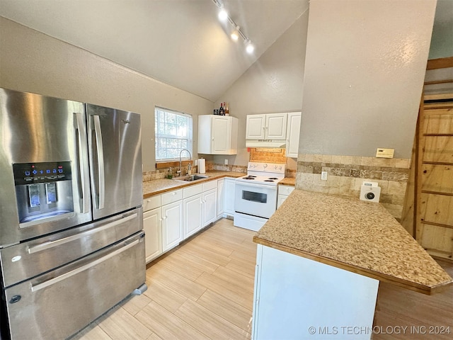 kitchen featuring stainless steel fridge, white cabinets, kitchen peninsula, and white electric stove