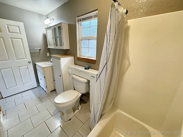 full bathroom with vanity, shower / bath combination with curtain, toilet, and tile patterned flooring