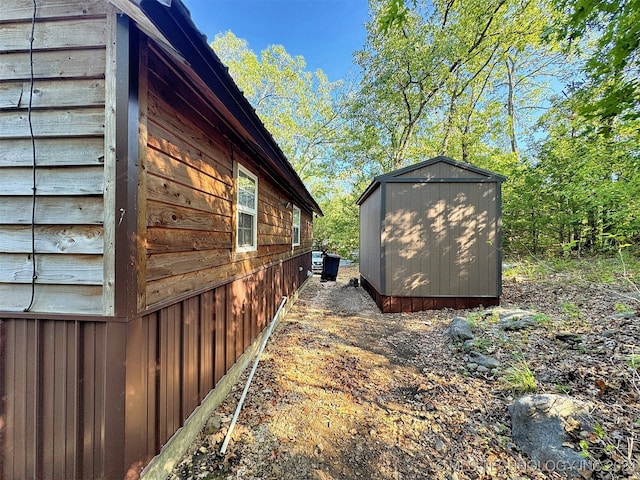 view of home's exterior featuring a shed