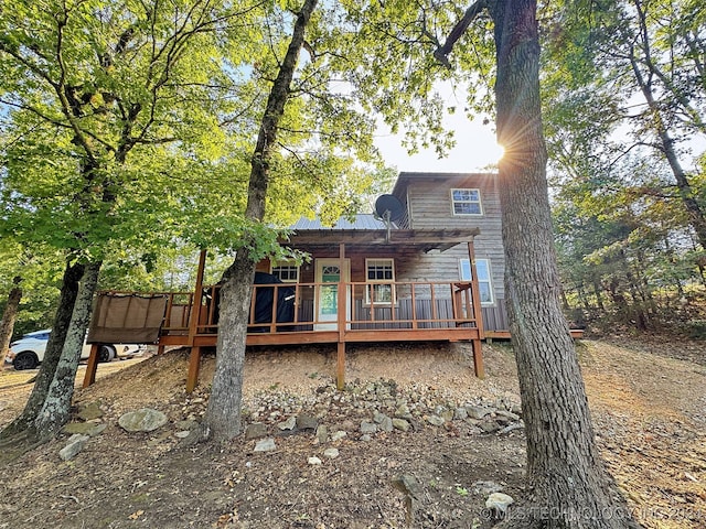 back of property with a deck