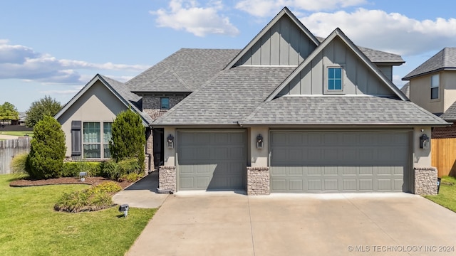 view of front facade with a garage and a front lawn