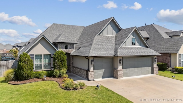 view of front of home featuring a garage and a front yard