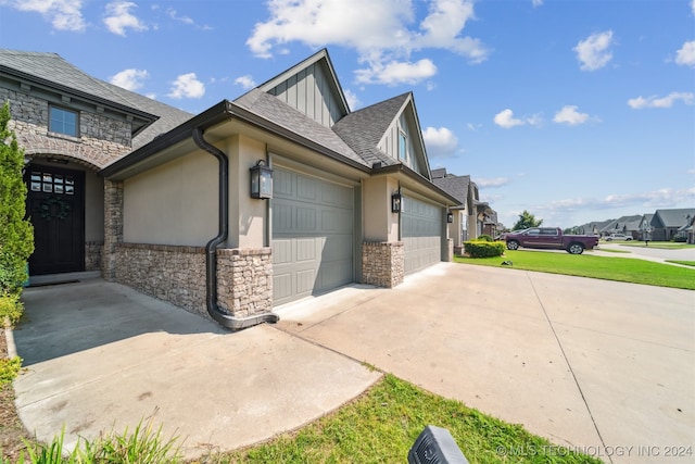 view of property exterior with a garage