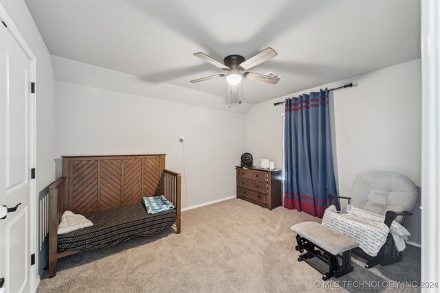 interior space with ceiling fan, lofted ceiling, and light carpet