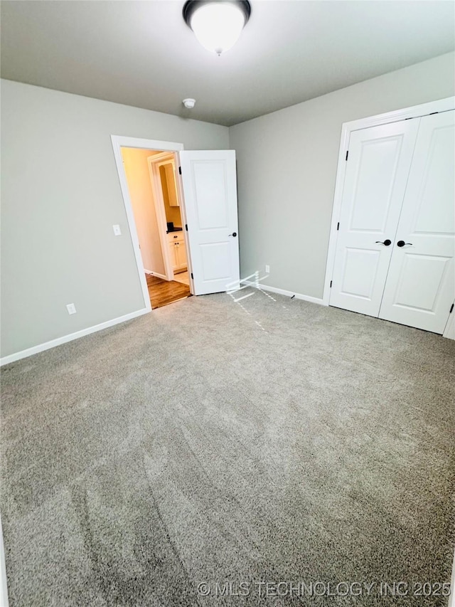 unfurnished bedroom with carpet floors and a closet