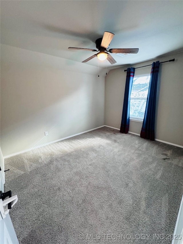 spare room with carpet and ceiling fan