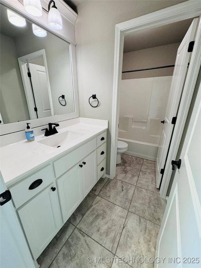 full bathroom featuring bathtub / shower combination, vanity, and toilet