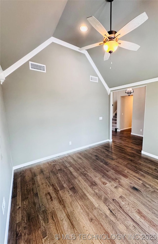 spare room featuring ceiling fan, lofted ceiling, and dark hardwood / wood-style flooring