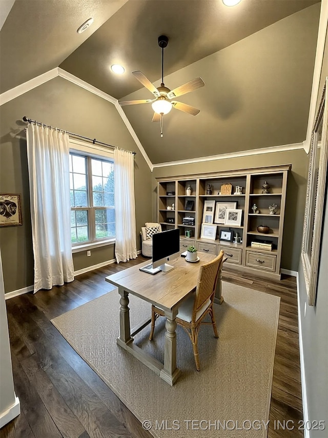 office space featuring crown molding, ceiling fan, dark hardwood / wood-style floors, and vaulted ceiling