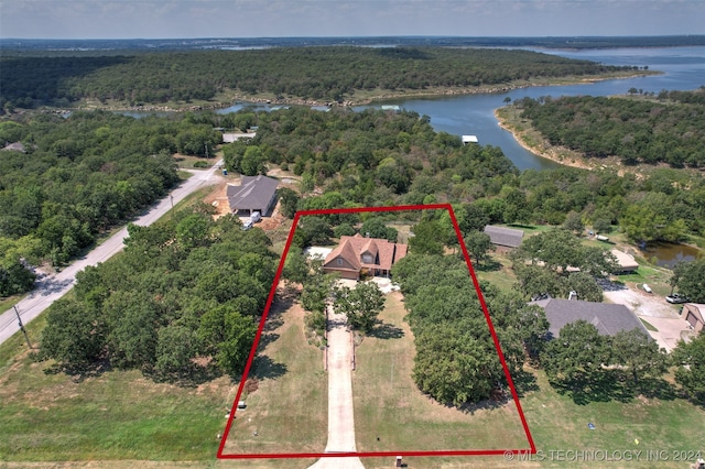 birds eye view of property with a water view