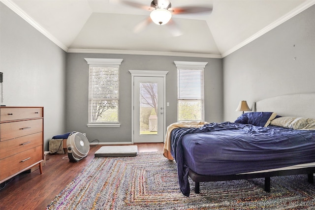 bedroom featuring ceiling fan, crown molding, lofted ceiling, and dark hardwood / wood-style floors