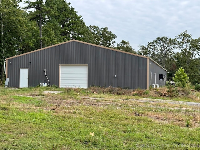 view of outbuilding featuring a garage