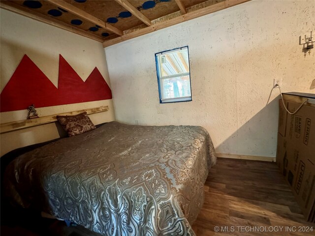 bedroom featuring hardwood / wood-style flooring