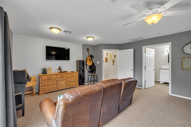 living room featuring light carpet and ceiling fan