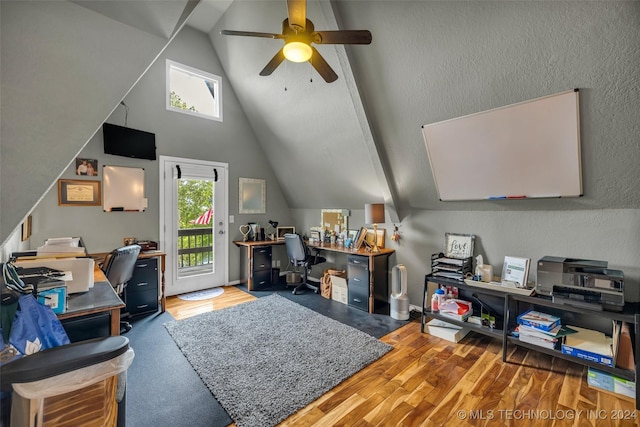 office space with plenty of natural light, ceiling fan, and lofted ceiling