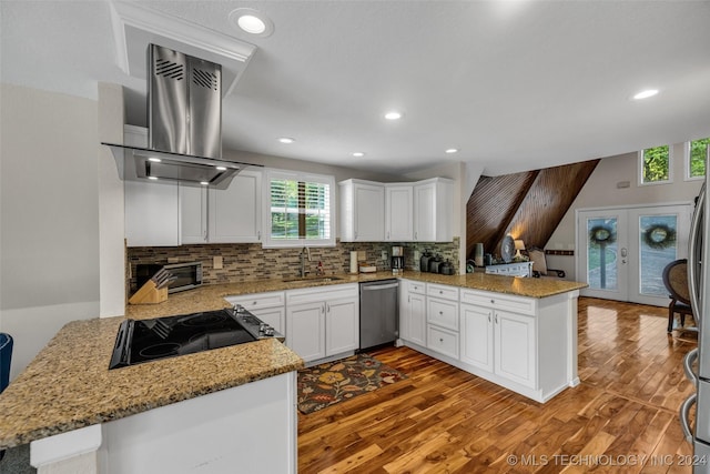 kitchen featuring kitchen peninsula, sink, exhaust hood, dishwasher, and white cabinets