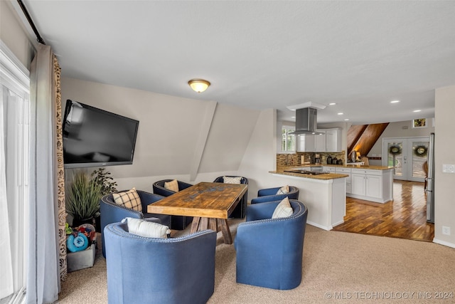 dining room featuring light colored carpet