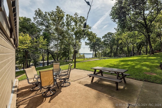 view of patio with a water view