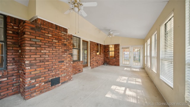 unfurnished sunroom featuring vaulted ceiling and ceiling fan