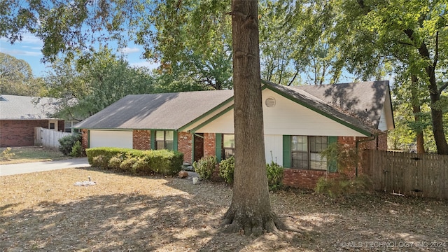 ranch-style home featuring a garage