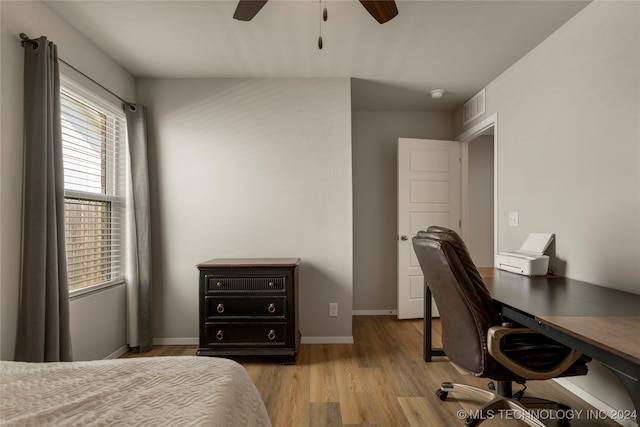 interior space with ceiling fan, light wood-type flooring, and multiple windows