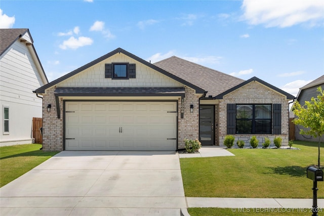 view of front facade featuring an attached garage, concrete driveway, brick siding, and a front yard